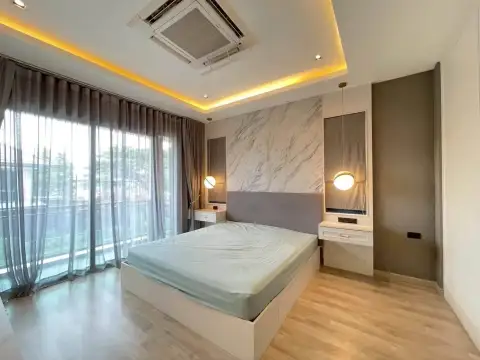 3 Bedroom House for Rent at Patta Define master bedroom with marble feature wall and pendant lights