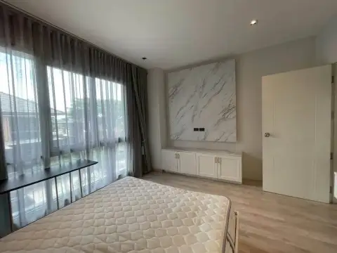 3 Bedroom House for Rent at Patta Define bedroom corner with marble accent panel and built-in cabinet