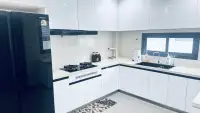 3 Bedroom House for Rent at Patta Define modern kitchen with white cabinets and gas stove