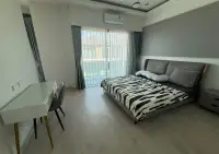 3 Bedroom House for Sale at Patta Define master bedroom with gray headboard bed and balcony access