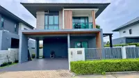 4 Bedroom House for Sale at Patta Define modern two-story exterior with carport and covered entrance