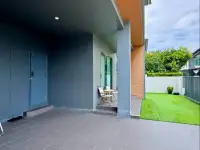 4 Bedroom House for Sale at Patta Define covered side entrance with tiled flooring and garden view