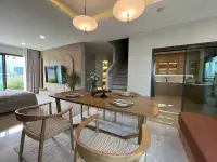 3 Bedroom House for Rent at Patta Element open-plan dining area with staircase and view into kitchen