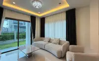 4 Bedroom House for Rent at Patta Element cozy lounge area with sectional sofa and recessed ceiling lighting