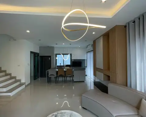 4 Bedroom House for Rent at Patta Element open-plan living room with staircase and dining area
