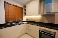 3 Bedroom House for Rent at Patta Prime kitchen with black countertops, built-in oven, and wood cabinetry