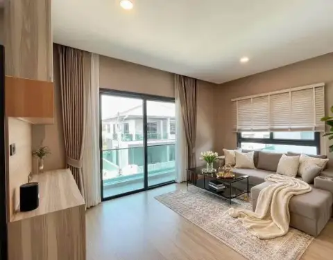 3 Bedroom House for Rent at Patta Ville living room with beige sofa and balcony window view