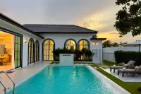 5 Bedroom House for Sale in Mabprachan outdoor pool with water feature and sun loungers at sunset
