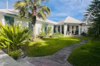 3 Bedroom House for Sale in Huai Yai landscaped garden with palm tree and stone pathway to house