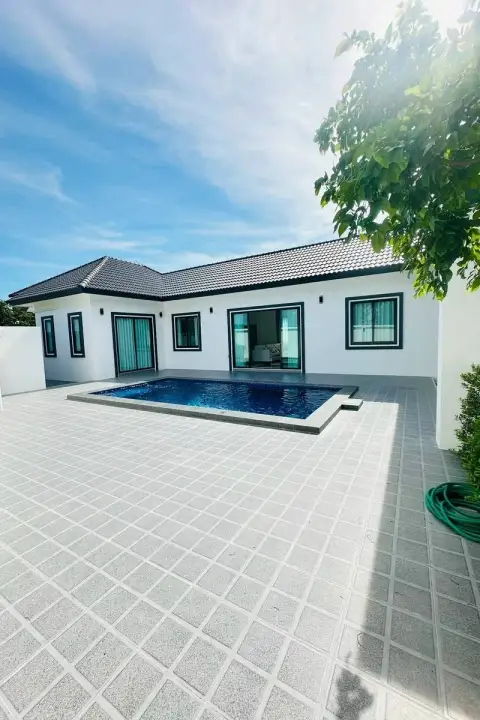 3 Bedroom House for Sale in Chak Nok exterior view showing pool, patio and tropical tree shading the yard