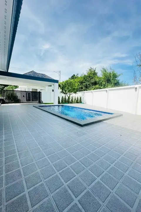 3 Bedroom House for Sale in Chak Nok side view of pool area with tiled deck and perimeter wall
