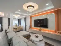 4 Bedroom House for Sale at Central Park 5 Village living room with sectional sofa and marble TV wall