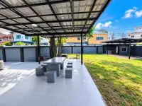 2 Bedroom House for Sale at Thanyawan Home covered outdoor seating area with stone table and garden view