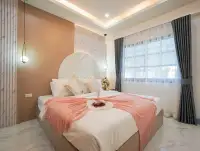 4 Bedroom House for Sale at Central Park 5 Village master bedroom with pink accents and marble headboard