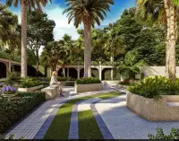 3 Bedroom Condo for Sale at The Riviera Malibu tranquil garden courtyard with palm trees and seating area