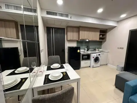 1 Bedroom Condo for Sale at Dusit Grand Condo View dining table setup beside kitchen and entrance door