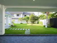 4 Bedroom House for Sale at Central Park 5 Village covered carport view of landscaped garden and pathway