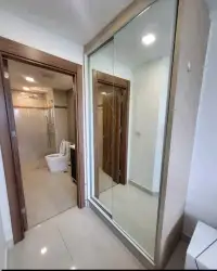 1 Bedroom Condo for Sale at Laguna Beach Resort 3 (The Maldives) mirrored closet doors beside bathroom with toilet and shower