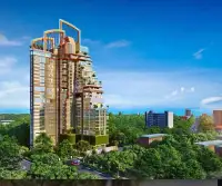 3 Bedroom Condo for Sale at The Riviera Malibu high-rise tower exterior surrounded by greenery near Pattaya coastline