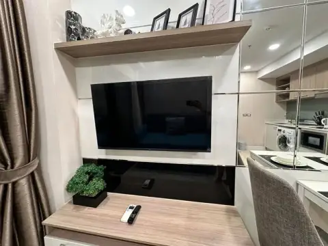 1 Bedroom Condo for Sale at Dusit Grand Condo View wall-mounted TV unit with decorative shelf and mirror