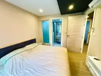 1 Bedroom Condo for Sale at Seven Seas Condo Resort bedroom with view into ensuite bathroom and closet doors