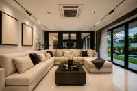 5 Bedroom House for Sale at Highgrove Villas living room with beige sectional sofa and pool view