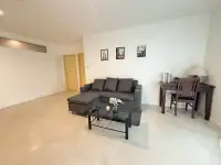 2 Bedroom Condo for Rent at Pattaya Heights living room with gray sectional sofa and glass coffee table