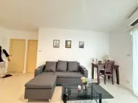 2 Bedroom Condo for Rent at Pattaya Heights lounge with sofa, study desk and wall art near bedroom doors