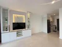 2 Bedroom Condo for Rent at Pattaya Heights open-plan living space with TV cabinet and view into kitchen