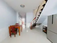 2 Bedroom House for Rent in Central Pattaya hallway with wooden dining table and staircase to upper floor