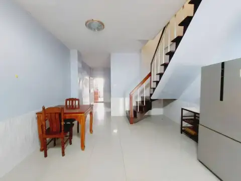 2 Bedroom House for Rent in Central Pattaya hallway with wooden dining table and staircase to upper floor