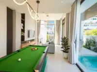 3 Bedroom House for Rent in Central Pattaya games room with pool table overlooking outdoor pool