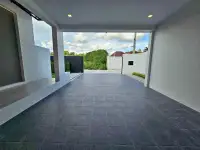 3 Bedroom House for Sale in Pong covered carport with tiled driveway and garden gate view