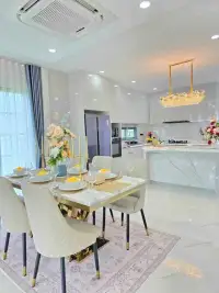 4 Bedroom House for Sale in Huai Yai dining area with marble table and open kitchen view