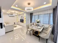 3 Bedroom House for Sale in Na Kluea open-plan living and dining space with elegant lighting fixtures