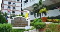 Studio Condo for Sale at Wongamat Garden Beach Resort entrance sign with tropical landscaping and building facade