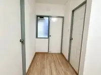 2 Bedroom Condo for Sale at Eua Arthorn Naklua hallway with wood flooring leading to bedroom and bathroom doors