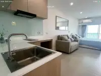 Studio Condo for Sale at Wongamat Garden Beach Resort open-plan kitchen with sink and view of living area