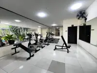1 Bedroom Condo for Sale fitness center with exercise bikes, treadmills and weight bench