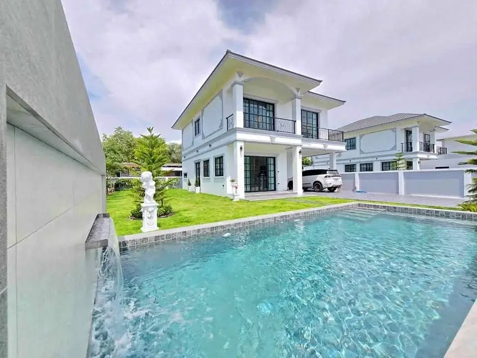 4 Bedroom House for Sale in Huai Yai two-story white villa with private pool and water feature wall