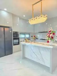 4 Bedroom House for Sale in Huai Yai modern kitchen with marble island and crystal pendant light