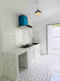 3 Bedroom House for Sale in Pattaya - kitchen with subway tile backsplash, gas stove, and blue range hood