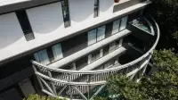 6 Bedroom House for Sale in Pratumnak Hill aerial view of modern facade with glass balconies and greenery