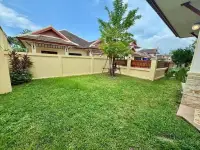 3 Bedroom House for Sale in Pattaya, private garden with green lawn and perimeter wall