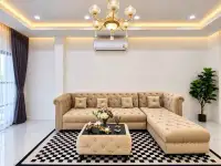 3 Bedroom Townhouse for Rent in Central Pattaya corner sofa with chandelier and checkered rug