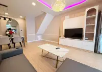 3 Bedroom Townhouse for Rent in Central Pattaya lounge area with flat-screen TV and built-in wall shelving