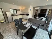 2 Bedroom Townhouse for Sale featuring open-plan kitchen, dining table and grey sofa living area