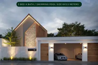Baan Mae Pool Villa modern exterior with a distinctive roofline, stone facade, and a two-car garage.