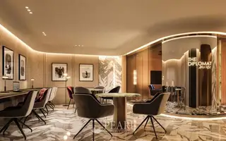 Embassy Pattaya 'The Diplomat Lounge' co-working space with tables, chairs, and modern decor.