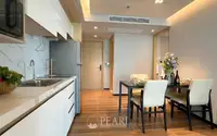 2 Bedroom Condo for Sale at Beverly Mountain Bay Pattaya modern kitchen with marble countertops and dining table for four